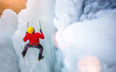 The climber climbs on ice.