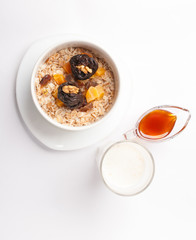 oatmeal with dried fruit on a white background
