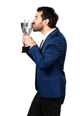 Handsome man holding a trophy