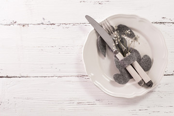 Spring Easter table setting with bunny shape . Space for text