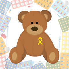 children's toy with a yellow ribbon on the background of pills and medications