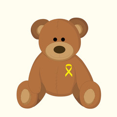 children's toy with a yellow ribbon as a symbol of childhood cancer