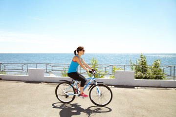 Young woman and bike