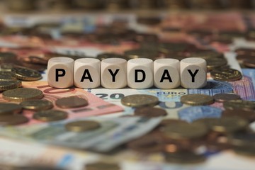 payday - cube with letters, money sector terms - sign with wooden cubes