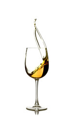 splash of white wine in the glass on a white background