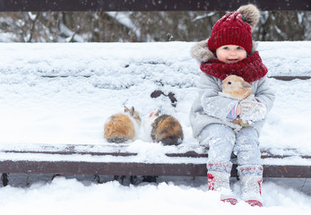Little girl with rabbit