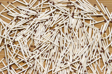 Matches are scattered randomly on the floor.
