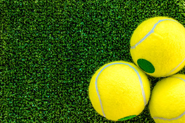 tennis ball on green background top view mock up