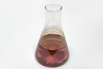 laboratory glass flask, full of pink solution