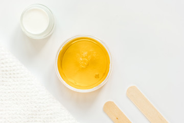 concept depilation with wax on white background top view