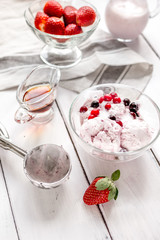 organic homemade ice cream in glass bowl on wooden background