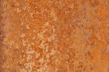 Rust on metal as a background. Orange rusty wall texture.