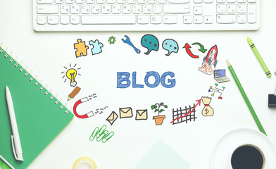 blog wit keyboard,notebook and stationary on table