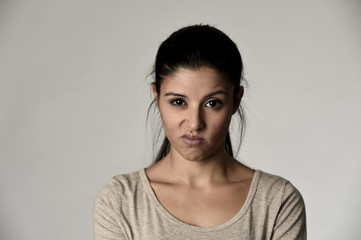 Fototapeta premium beautiful arrogant and moody hispanic woman showing negative feeling and contempt facial expression
