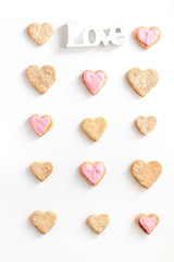 Fototapeta premium cookies for Valentine Day heartshaped white background top view pattern