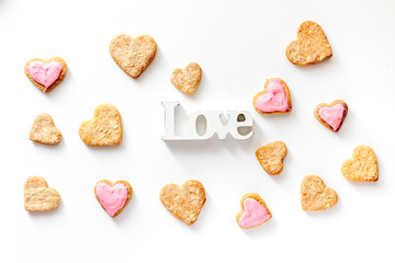 cookies for Valentine Day heartshaped white background top view pattern