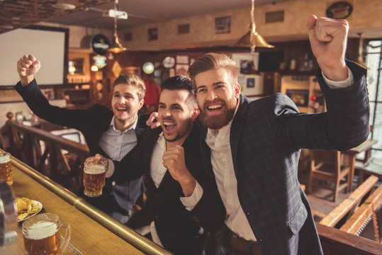 Men at the pub - Powered by Adobe