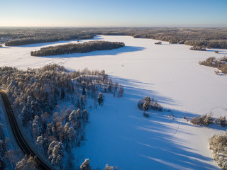 View from the bird's-eye view on a winter forest and lake
