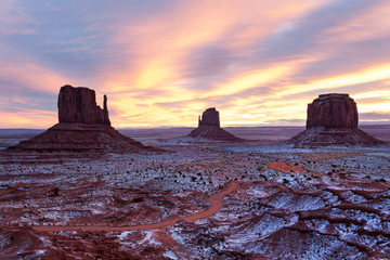 Sunset over snow covered Monument Valley Navajo tribal park, Arizona
