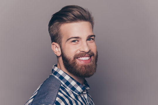 Side view portrait of cheerful stylish man with beaming smile