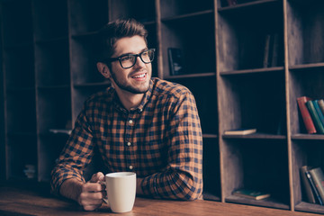 Portrait of handsome manager having break and dreaming with cup