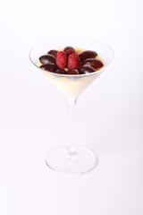 Pudding with grapes on a white background