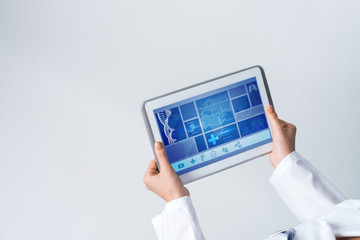 Close of female doctor hands working with tablet pc computer