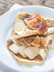 Crepes with brie and caramelized slices of apple