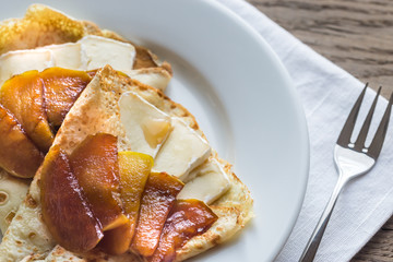 Crepes with brie and caramelized slices of apple © alex9500