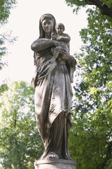 silver statue of the Virgin Mary with the baby Jesus Christ in h