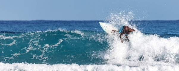 Surfer on beautiful ocean wave. Water sport activity