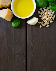pesto ingredients on wooden surface