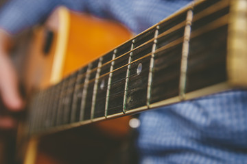 Close up of guitarist hand playing guitar