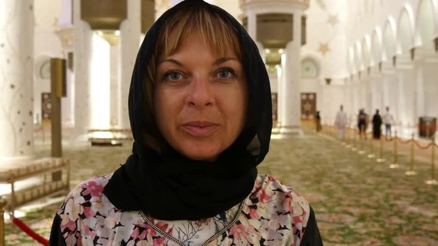 A European woman in Dubai mosque. Closeup.