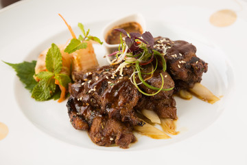 Marinated Striploin Beef. Grilled, marinated striploin of beef with sweet potato and asparagus. Spicy beef steak, vietnamese style.