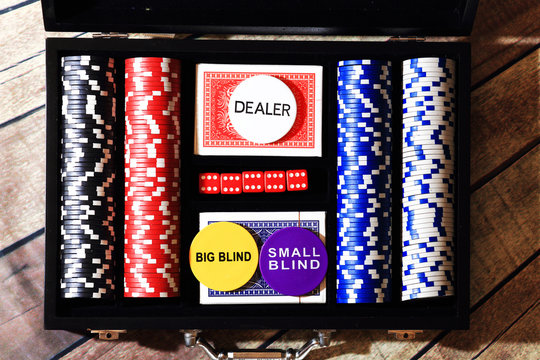 Poker chips cards and dice in  suitcase