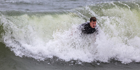 Young Man Surfing