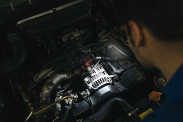 Fototapeta na wymiar Professional Mechanic Repairing Car Engine.