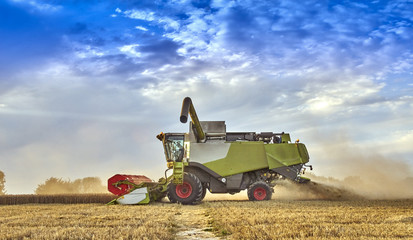 Combine harvesting on the South Downs in Sussex, UK