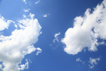 Naklejka na ściany i meble Blue sky with beautiful clouds useful as a background or print card.