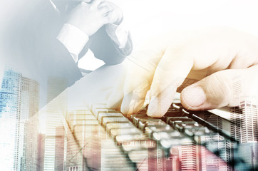 Double exposure of success businessman using Laptop with  businessman using keyboard , education, programming, people and technology background