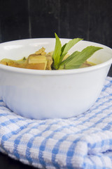 Green pork curry with old wooden background , Thai cuisine