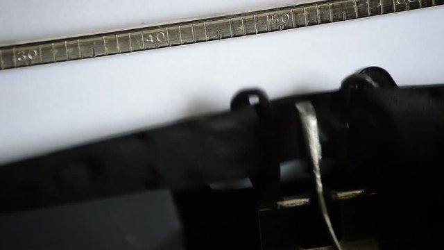 Typing the word INFO with an old manual typewriter