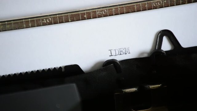 Typing the word IDEM with an old manual typewriter