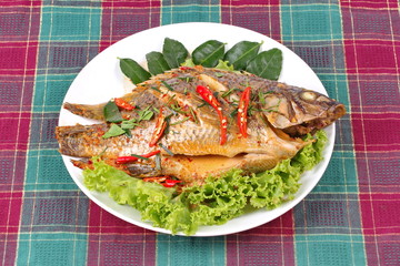 Curry-fried Tilapia fish with spicy topping.