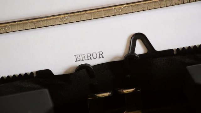 Typing the word ERROR with an old manual typewriter