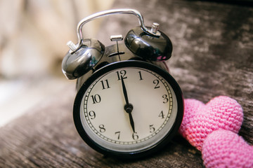 Love clock at 6 o'clock, Time of sweet loving pass memories story on the old wood background.