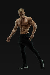 Fototapeta na wymiar Full-length shot of young man with muscular body