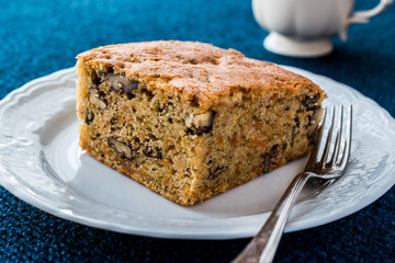 Carrot Cake with walnut, cinnamon and cup of tea or coffee