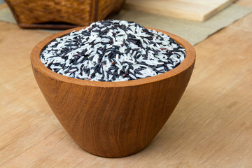 rice berry in wood bow on table